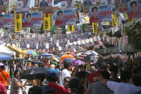 A street in suburban Manila, the capital of the Philippines, is covered in campaign posters. Polls opened nationwide on Monday, May 9, 2016. 