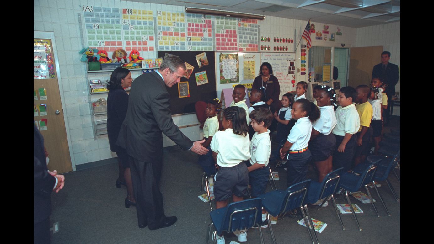 U.S. President George W. Bush greets students as he visits an elementary school in Sarasota, Florida, on September 11, 2001. It was here where Bush first learned of the terrorist attacks against the United States. These photos, taken by former White House photographer Eric Draper, were recently released by the George W. Bush Presidential Library and Museum.