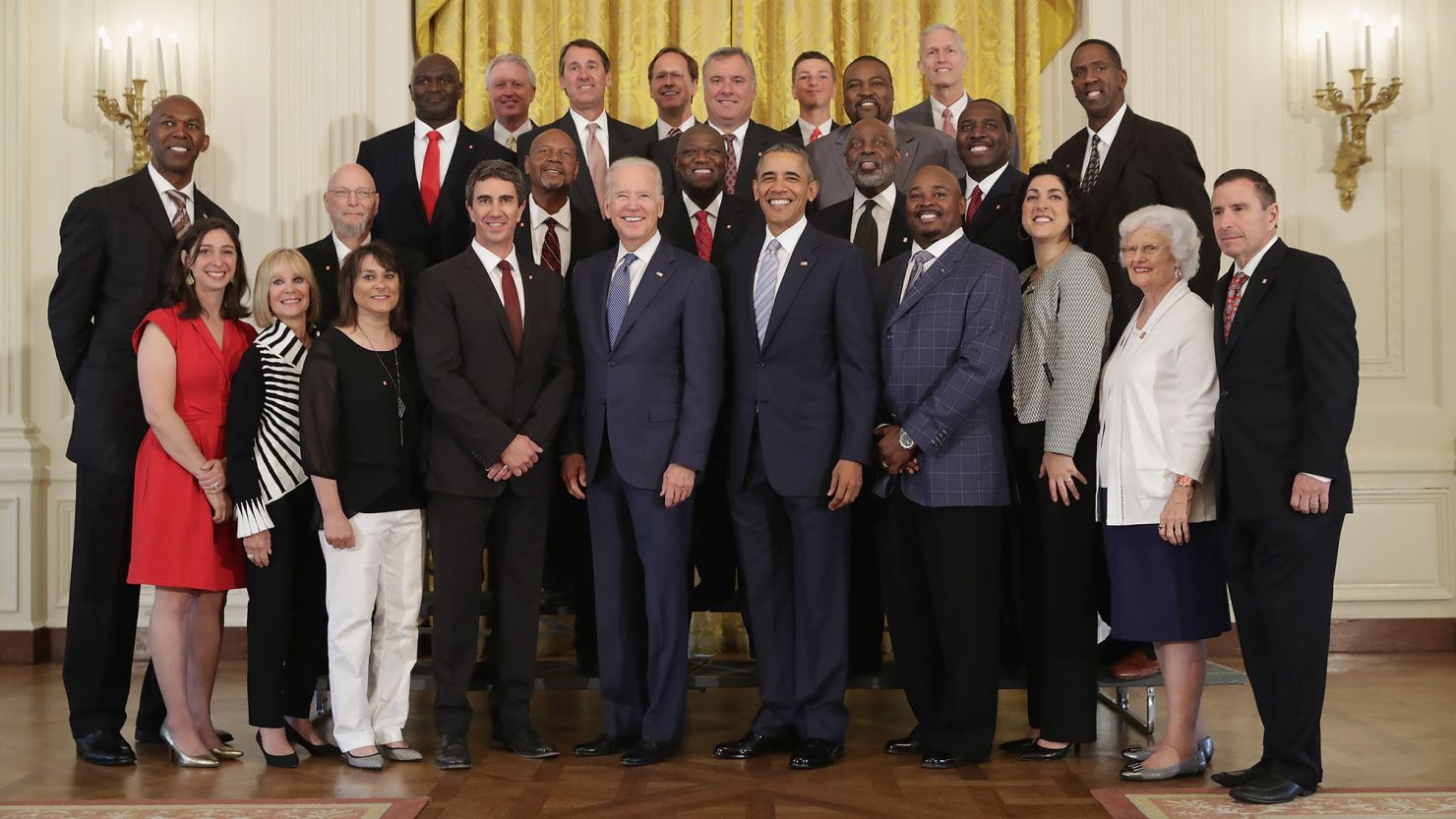 President Barack Obama and Vice President Joe Biden pose for photographs with members of the 1983 NCAA championship North Carolina State men's basketball team to the White House May 9. Obama honored the Wolfpack's historic win at the White House 33 years after their national victory. 