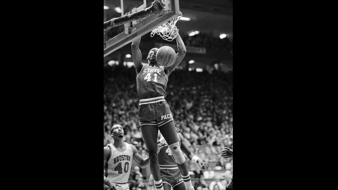 North Carolina State forward Thurl Bailey dunks the ball during the NCAA championship game against Houston in Albuquerque, New Mexico in 1983. NC State won the national championship, 54-52.