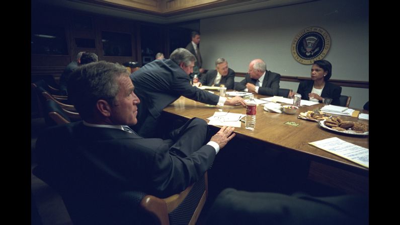 Bush meets with his staff after delivering his address. Want to see more? <a href="index.php?page=&url=http%3A%2F%2Fwww.cnn.com%2F2015%2F03%2F11%2Fworld%2Fgallery%2Fosama-bin-laden-rare-photos%2Findex.html">Rare photos</a> offer look inside Osama bin Laden's Afghan hideout. 