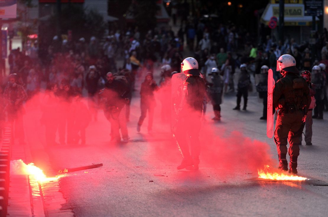 Police face protesters throwing flares and molotov coctails during a protest rally outside the Greek parliament building Athens,  May 8, 2016.