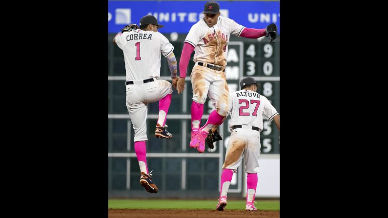 Houston's Carlos Correa and George Springer celebrate a home win over Seattle on Sunday, May 8. The team was wearing pink in honor of Mother's Day and breast cancer awareness.