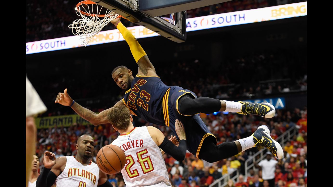 Cleveland's LeBron James dunks over Kyle Korver during an NBA playoff game in Atlanta on Friday, May 6. The Cavs swept the Hawks to advance to the Eastern Conference finals.