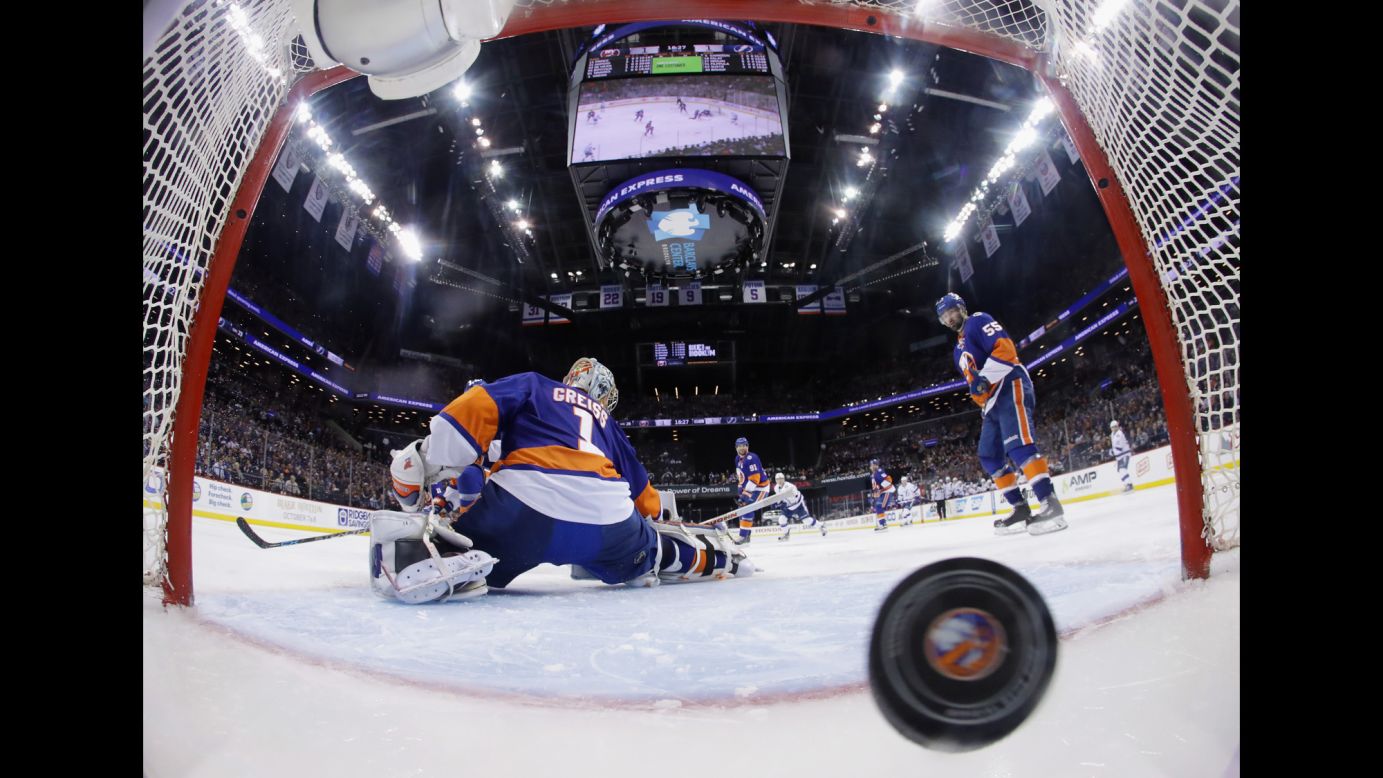The puck gets behind New York Islanders goalie Thomas Greiss on Friday, May 6, giving the Tampa Bay Lightning an overtime victory in Game 4 of their NHL playoff series. Jason Garrison scored the game-winning goal, and the Lightning would go on to win the series in five games.