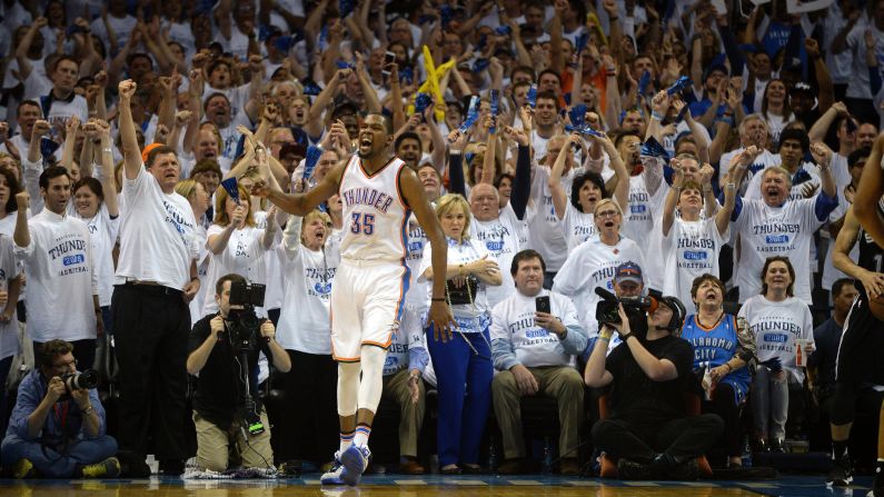 Kevin Durant and Oklahoma City fans react during the fourth quarter of an NBA playoff game against San Antonio on Sunday, May 8. Durant scored 41 points in the game -- a personal playoff high -- as the Thunder tied the second-round series at two games apiece.