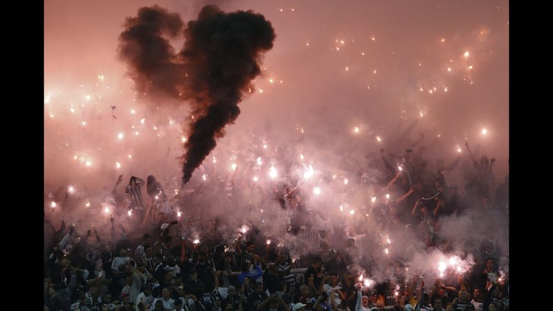 Fans of the Brazilian soccer club Corinthians light flares Wednesday, May 4, before a Copa Libertadores match in Sao Paulo, Brazil.