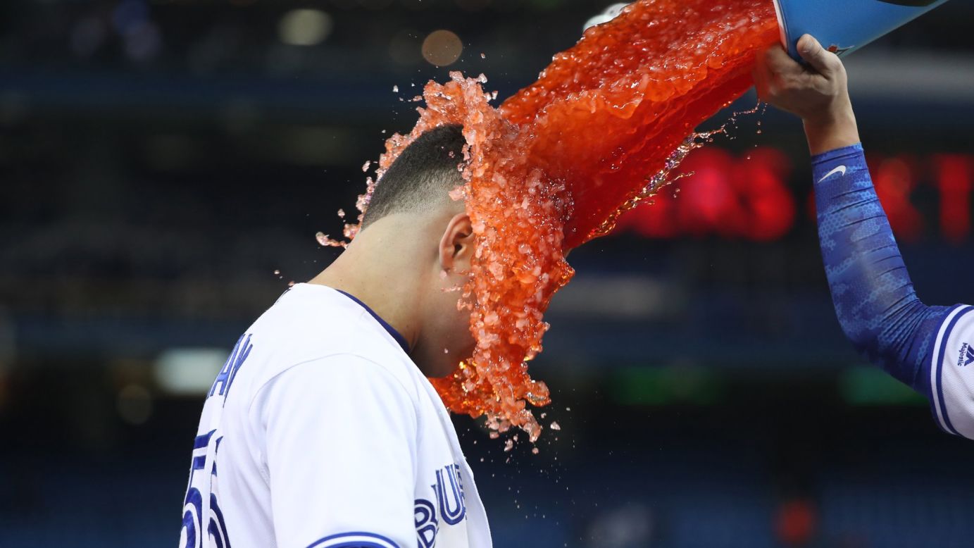 Toronto catcher Russell Martin has Gatorade dumped on him by a teammate after hitting the game-winning hit against Texas on Wednesday, May 4. 