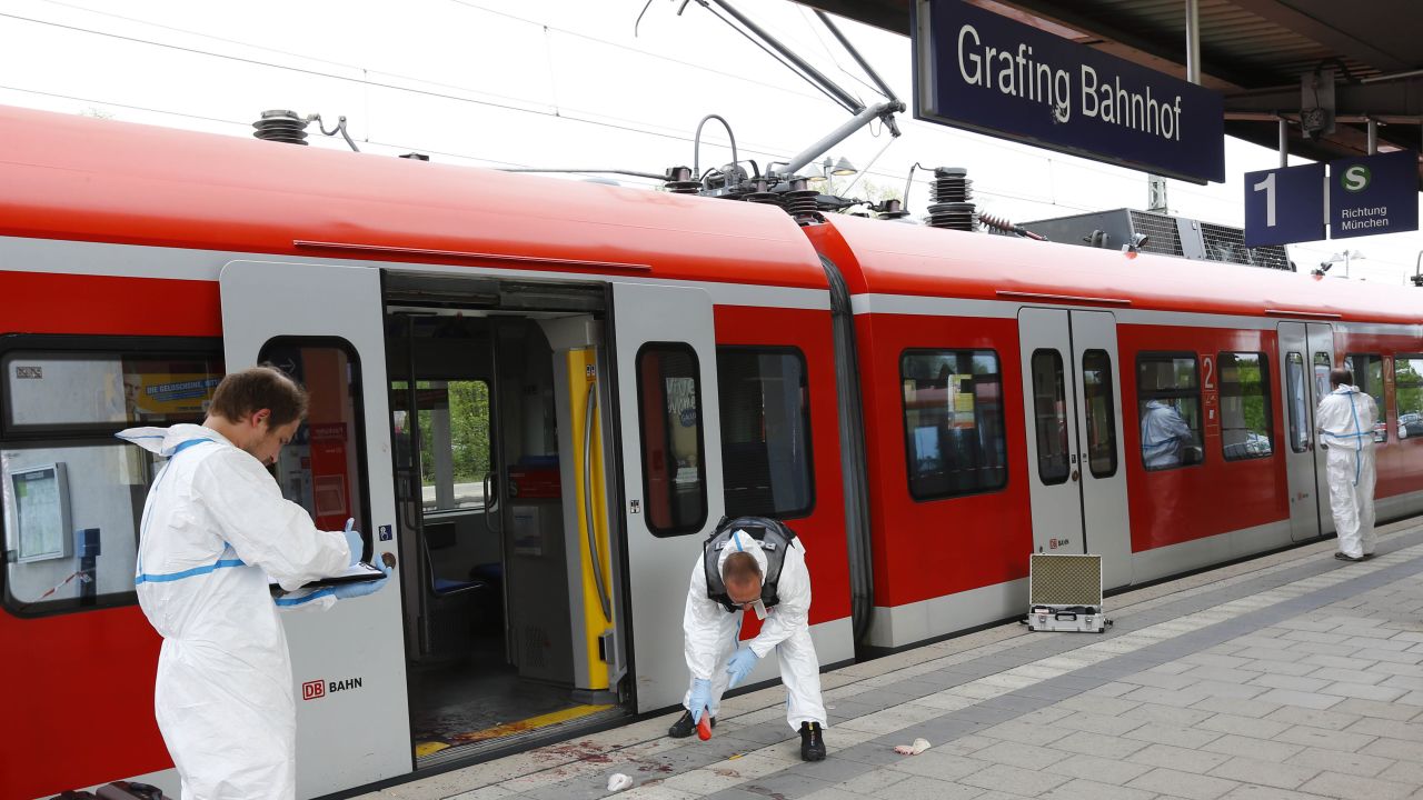 Police investigate the scene of multiple stabbings at a train station in Grafing near Munich, Germany.