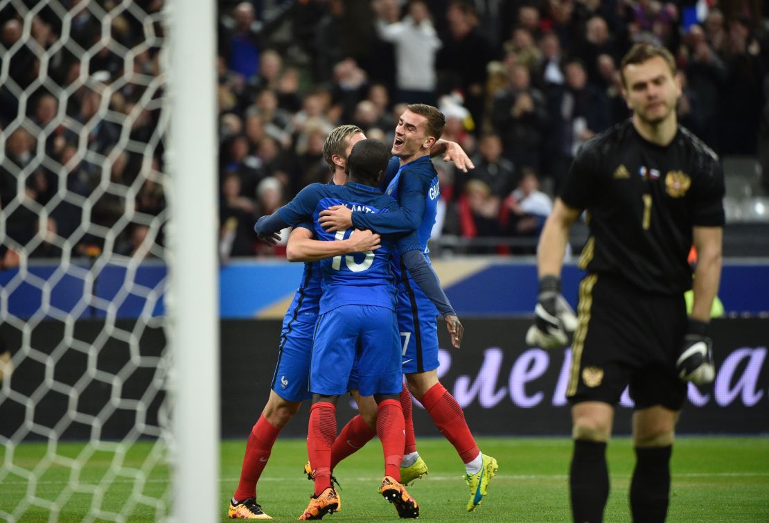 N'Golo Kante (center) celebrates a debut France goal on his 25th birthday.