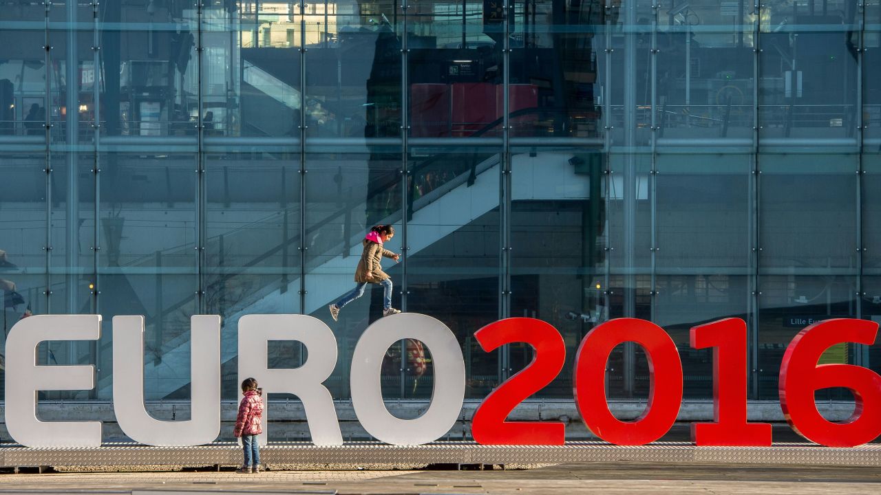 Children play on February 3, 2016 around giant letters of the "UEFA EURO 2016" in Lille  where some of the Euro 2016 football matches will take place. / AFP / PHILIPPE HUGUEN        (Photo credit should read PHILIPPE HUGUEN/AFP/Getty Images)