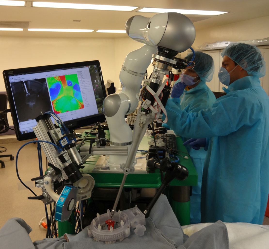 Surgeons monitor an operation performed by the Smart-Tissue Autonomous Robot (STAR).