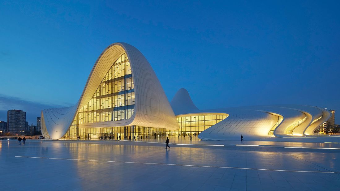 The Heydar Aliyev Center in Baku, Azerbaijan, marks a departure from the city's well-established Soviet-style architecture. The curved exterior is reflective, meaning that its appearance changes significantly throughout the day.