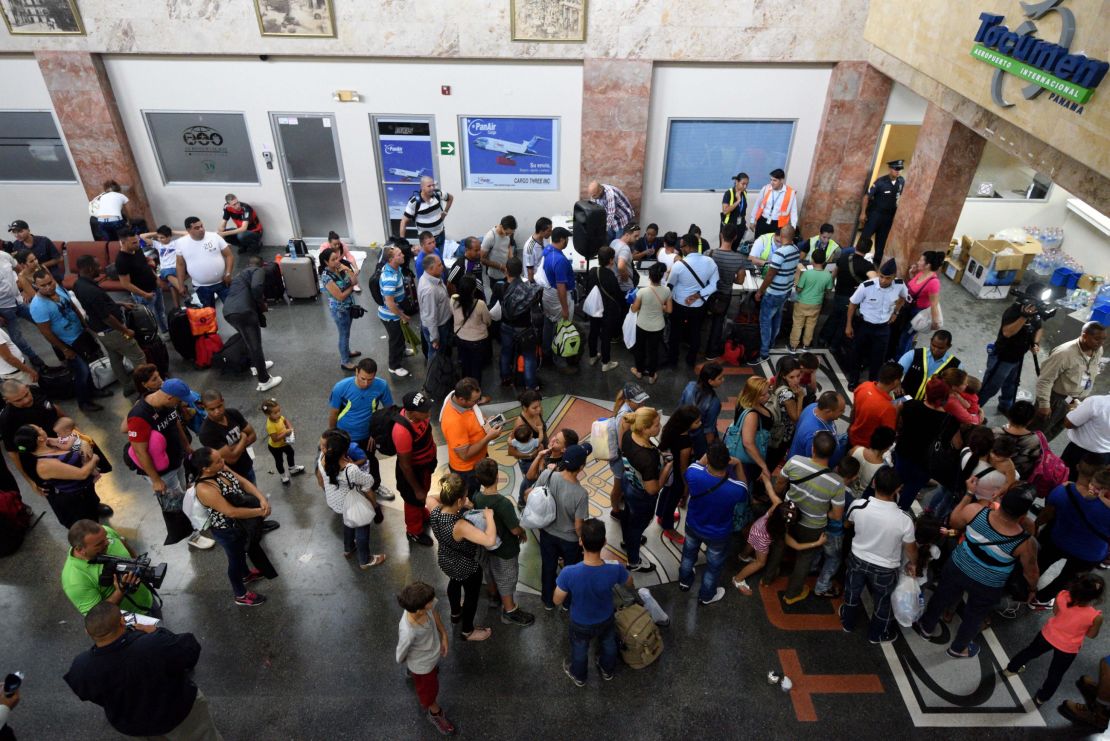 Cubans wait Tuesday at Panama City's airport for flights to northern Mexico.