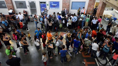 Cubans wait Tuesday at Panama City's airport for flights to northern Mexico.