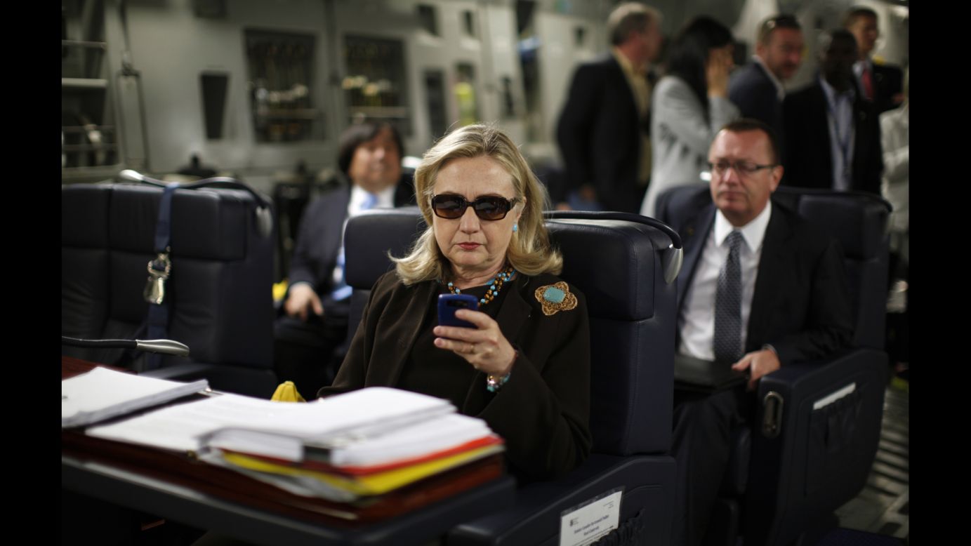 Clinton checks her Blackberry inside a military plane after leaving Malta in October 2011. In 2015, The New York Times reported that Clinton exclusively used a personal email account during her time as secretary of state. The account, fed through its own server, raises security and preservation concerns. Clinton later said she used a private domain out of "convenience," but admits in retrospect "it would have been better" to use multiple emails.