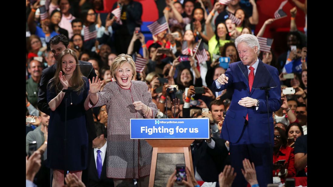 Clinton walks on her stage with her family after winning the New York primary in April.