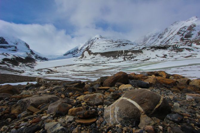 Flowing out of the Columbia Icefield, the Athabasca Glacier can be seen along the Icefields Parkway in Banff National Park, Alberta. This parkway through Banff and Jasper National Parks is the best route to see the Canadian Rockies and connects you to the Cassiar Highway.