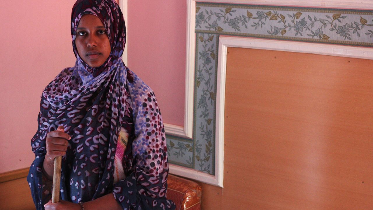 Naaj Ma, one of the housekeepers, keeps rooms spotless.