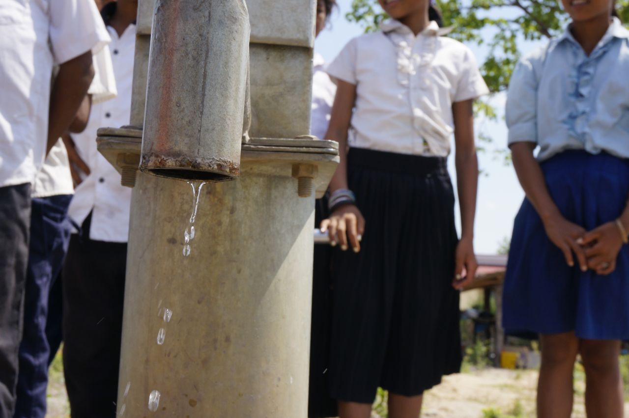 A water pump drips at a school in Kampong Chhang in Cambodia. The children here cannot pump enough for their school and have to buy extra water.
