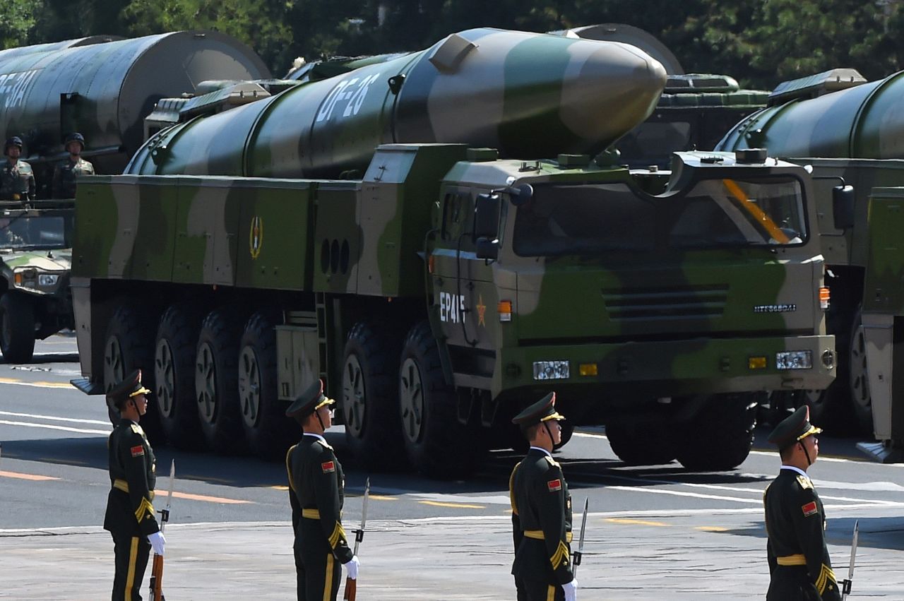 <strong>Chinese military vehicles carrying DF-26 ballistic missiles participate in a military parade at Tiananmen Square in Beijing in 2015. The missile has been dubbed "the Guam killer" by analysts for their ability to hit the strategic US island in the Pacific.</strong>