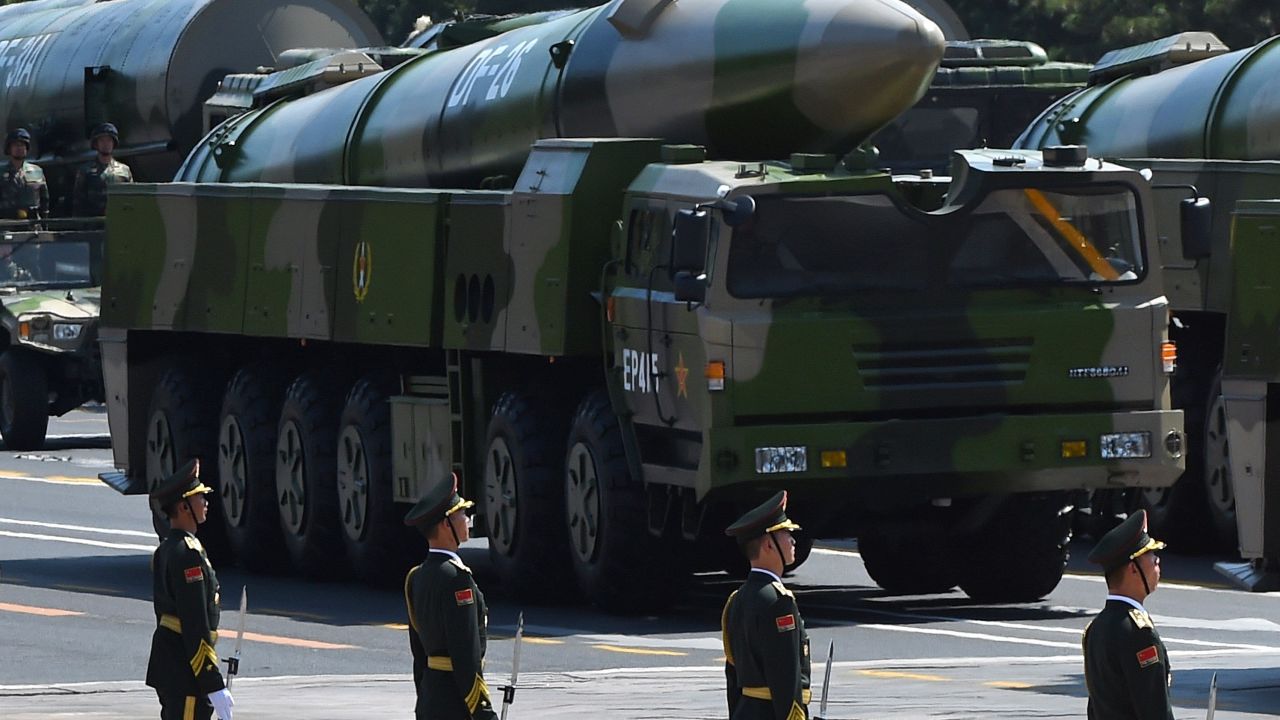 Chinese military vehicles carrying DF-26 ballistic missiles participate in a 2015 military parade in Beijing.