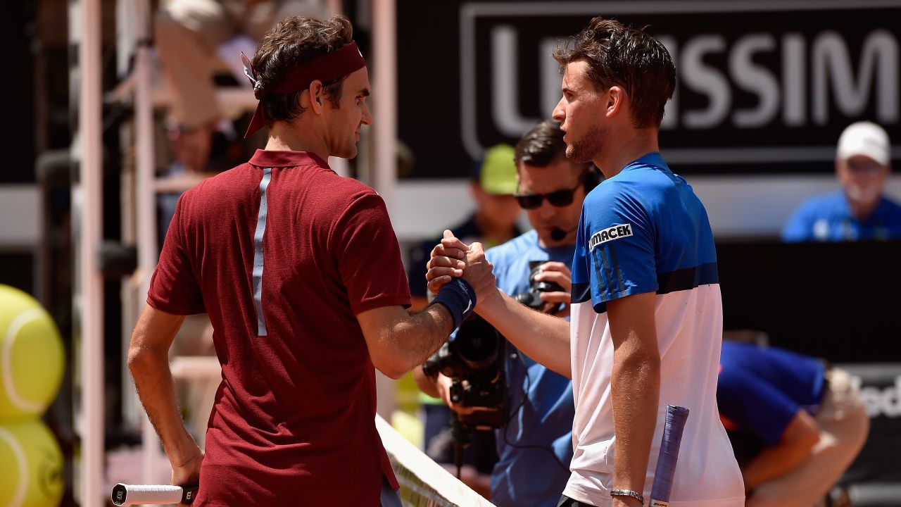 Roger Federer shakes hands with Dominic Thiem after his third-round loss at the Italian Open.