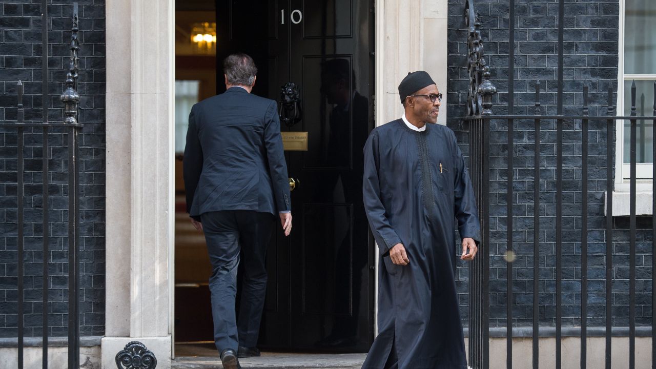 Britain's Prime Minister David Cameron (L) leaves Nigeria's President-elect Muhammadu Buhari following a meeting in Downing Street, central London on May 23, 2015. AFP PHOTO / LEON NEAL        (Photo credit should read LEON NEAL/AFP/Getty Images)