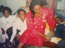 Uche Aguh (on the right) with his mother and siblings in Aba, Nigeria. The family later moved to America when he was 10-years-old.