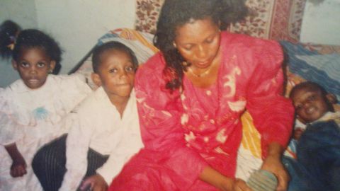 Uche Aguh (on the right) with his mother and siblings in Aba, Nigeria. The family later moved to America when he was 10-years-old.