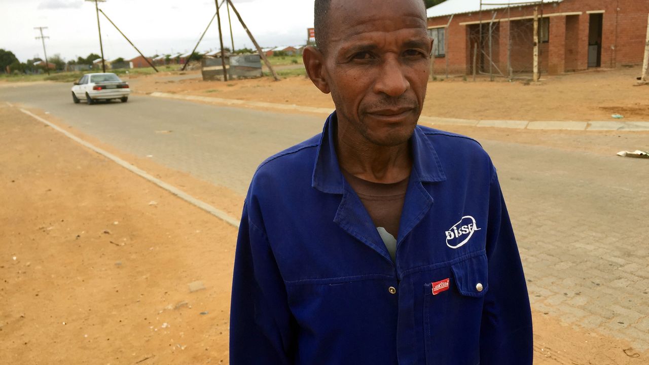 Joseph Mothibedi worked in gold mines for 30 years. Now he has silicosis and has trouble walking.