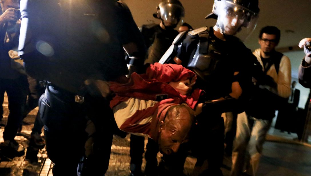 Riot police arrest a Rousseff supporter during a protest in Sao Paulo, Brazil on May 12.