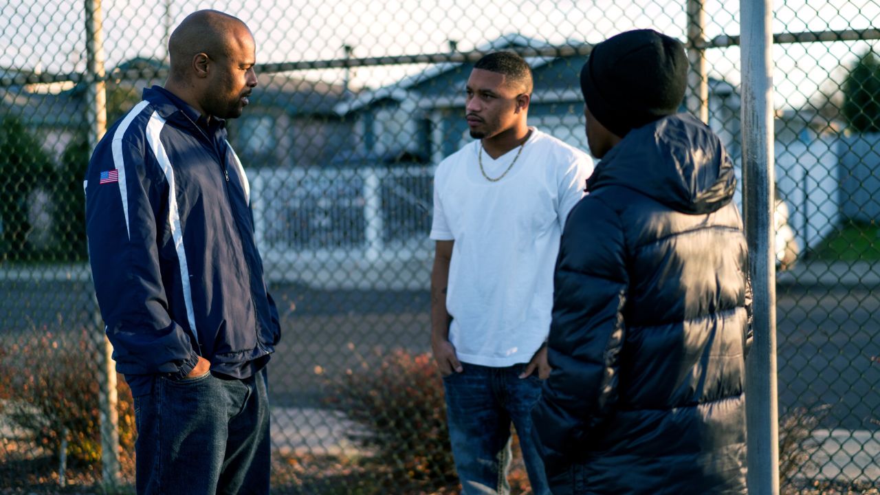 Mentor Houston talks with Richmond residents; the city has seen a dramatic reduction in homicides since the program began. 
