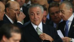 BRASILIA, BRAZIL - MAY 12:  Brazil's interim President Michel Temer (C) attends a swearing in ceremony for new government ministers at the Planalto presidential palace after the Senate voted to accept impeachment charges against suspended President Dilma Rousseff on May 12, 2016 in Brasilia, Brazil. Rousseff has been suspended from her presidential duties and will face a Senate trial for alleged manipulation of government accounts.  (Photo by Mario Tama/Getty Images)