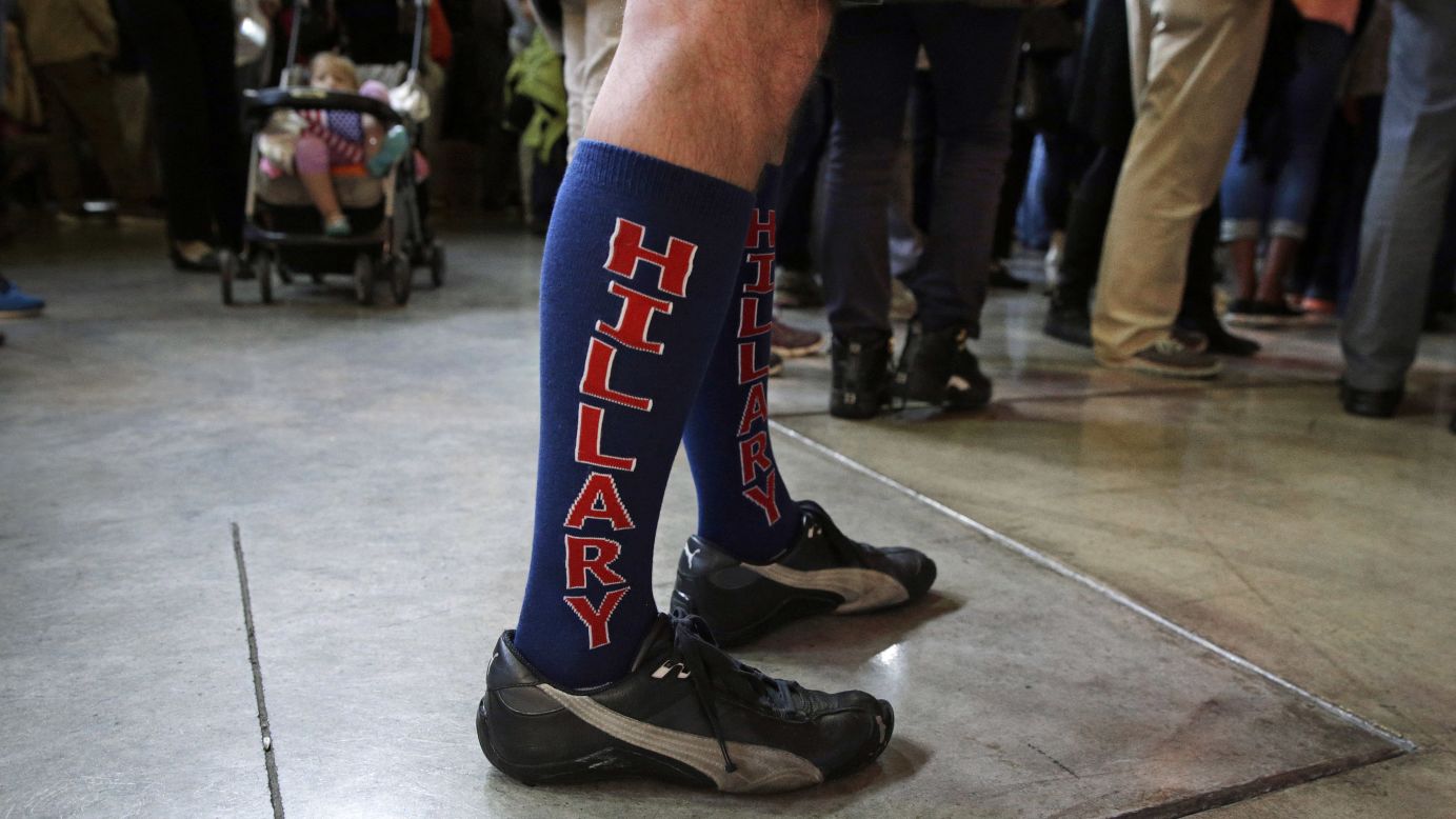 A man wears socks in support of Hillary Clinton as he listens to the presidential candidate speak in Louisville, Kentucky, on Tuesday, May 10.