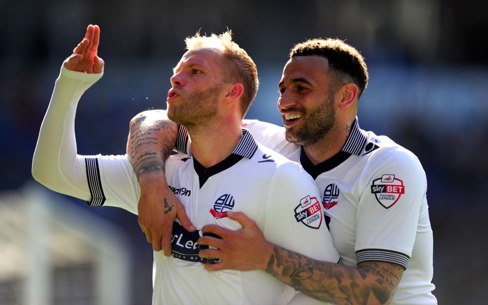 Star striker Eidur Gudjohnsen (left, formerly with Bolton), celebrates a goal with Craig Davies in 2015. Gudjohnsen, 37, is the team's elder statesmen, as well as it's most famous international player. The forward won titles with Chelsea and Barcelona.