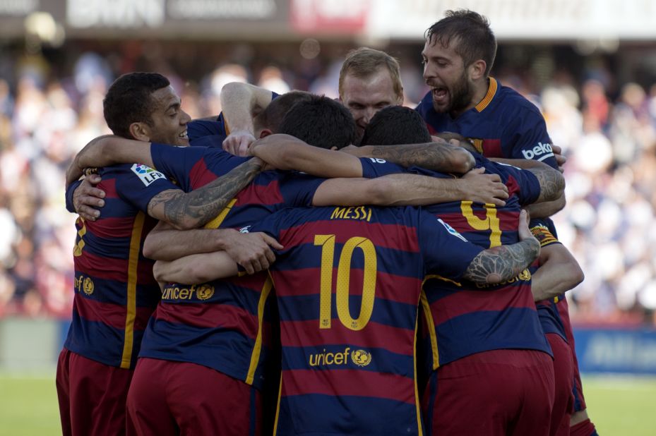 Barcelona's players celebrate a 24th La Liga title after a 3-0 win at Granada.