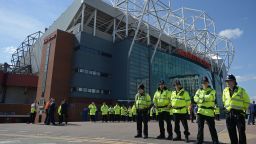 Police officers stand on duty outside Old Trafford stadium in Manchester, north west England, on May 15, 2016, after the English Premier League football match between Manchester United and Bournemouth was abandoned.
Police ordered Manchester United to abandon their final Premier League game of the season against Bournemouth on Sunday after a suspicious package was discovered at Old Trafford. / AFP / OLI SCARFF / RESTRICTED TO EDITORIAL USE. No use with unauthorized audio, video, data, fixture lists, club/league logos or 'live' services. Online in-match use limited to 75 images, no video emulation. No use in betting, games or single club/league/player publications.  /         (Photo credit should read OLI SCARFF/AFP/Getty Images)