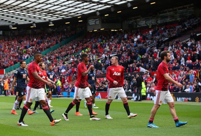 The Manchester United players, including Wayne Rooney, leave the field after warming up for what would have been their final game of the English Premier League season.