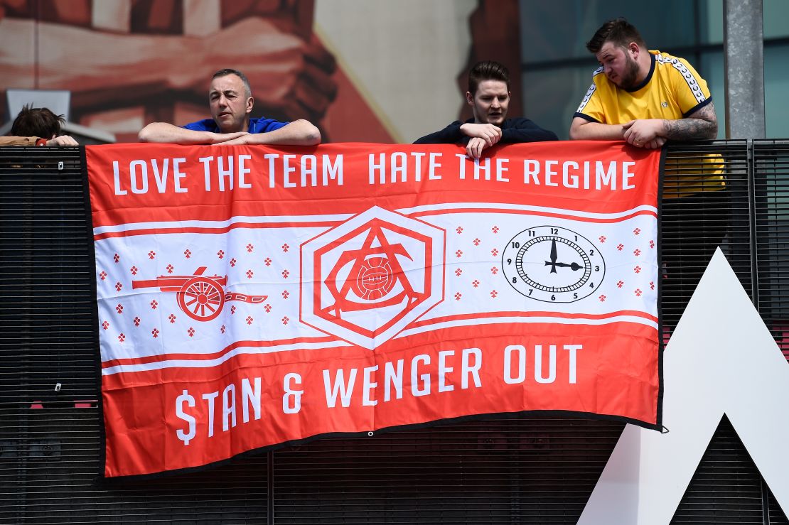 Despite the win, Arsenal fans show their displeasure towards manager Arsene Wenger and owner Stan Kroenke.