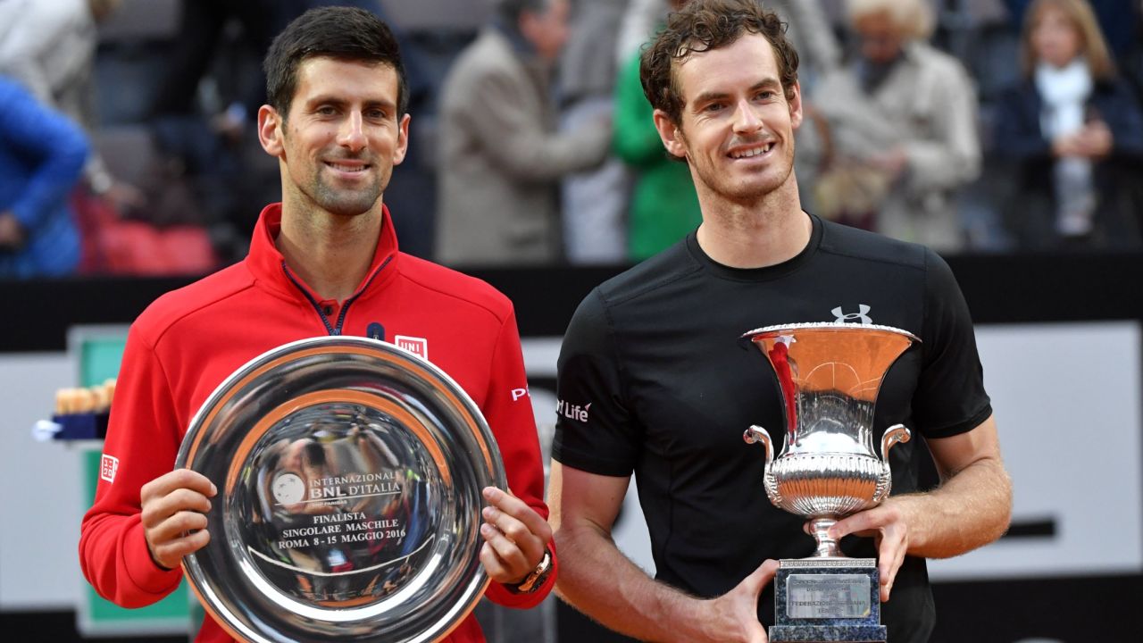Andy Murray and Novak Djokovic pose with their trophies following the Scot's victory in the Italian Open final