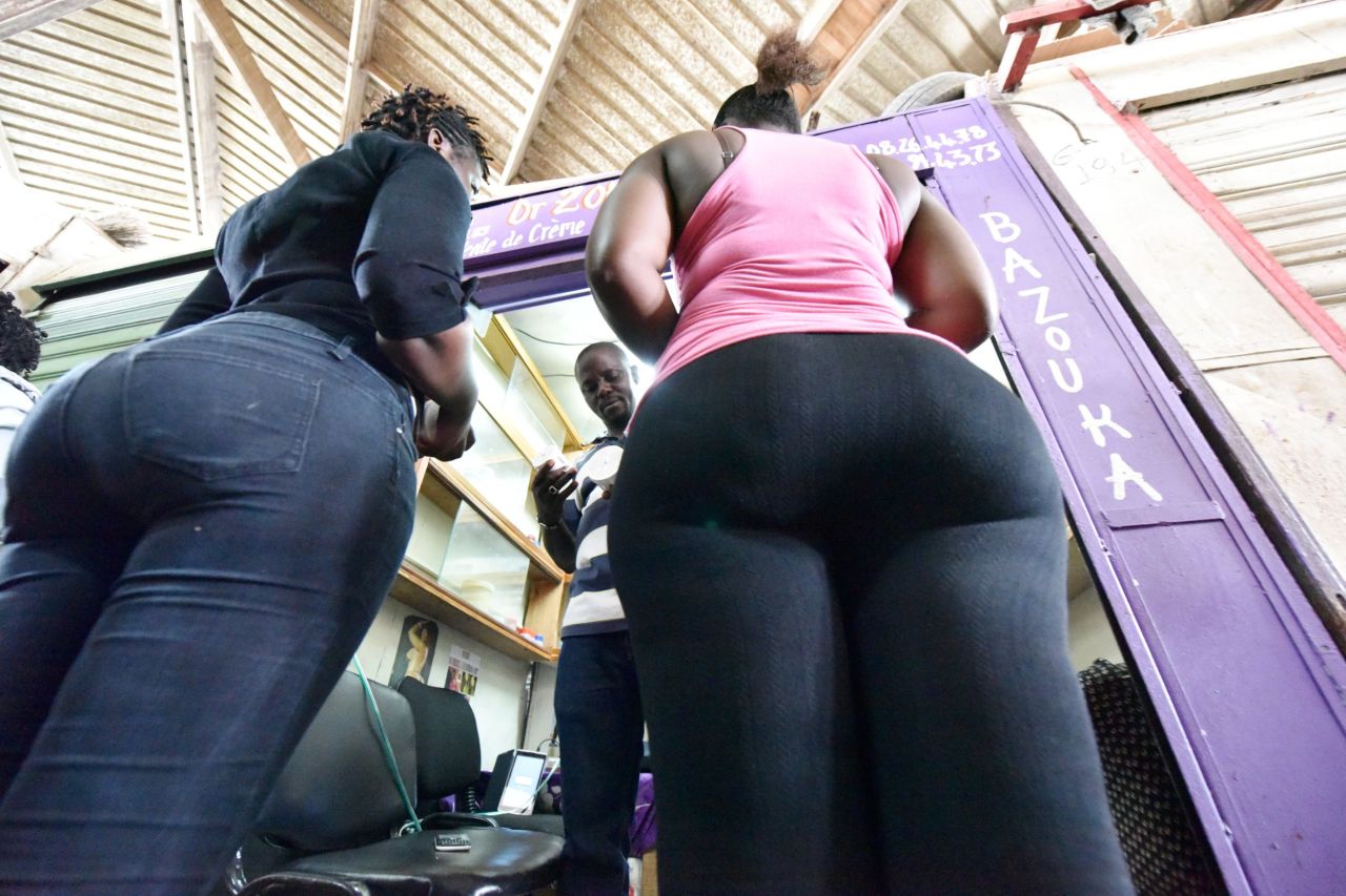 Women buy bottom enhancer products in a market of Treichville suburb of Abidjan, Ivory Coast, where "big is beautiful" bottom enhancers come in all shapes and sorts, and at any cost.