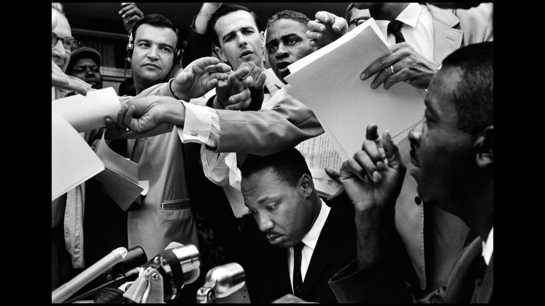 The Rev. Martin Luther King Jr. is surrounded at a news conference in Birmingham, Alabama, in 1962.