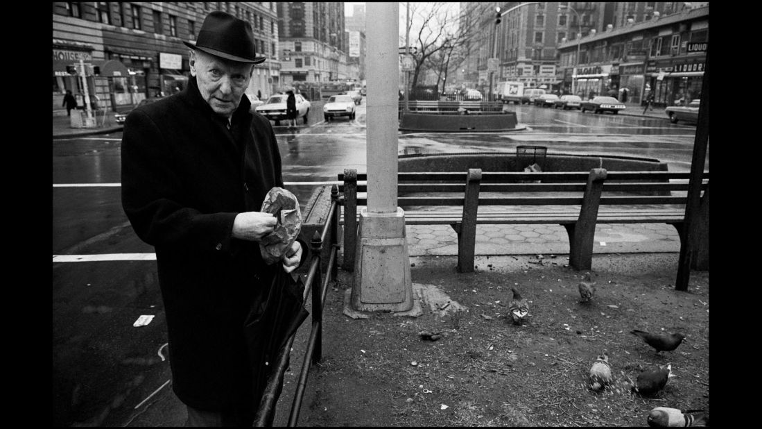 Isaac Bashevis Singer, an author who won the Nobel Prize in Literature in 1978, feeds birds in New York in 1975.