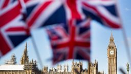 A display of U.K., Union Jack flags fly in front of The Houses of Parliament, in London, U.K., on Monday, Feb. 15, 2016. U.K. lawmakers are not the only ones bracing for a tough few months before Britain's referendum on its European Union membership. A gauge of expected volatility for the pound near the highest since 2011 shows traders are expecting a rough ride too. 