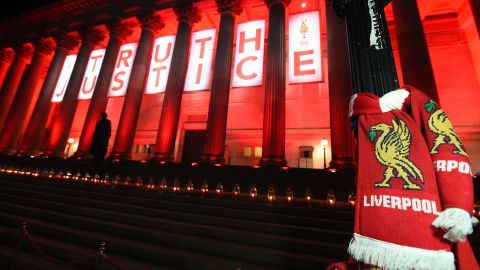 Candles adorn the steps of Liverpool's St Georges Hall on April 26, 2016, in remembrance of 96 Liverpool football fans who died in the Hillsborough stadium disaster.
