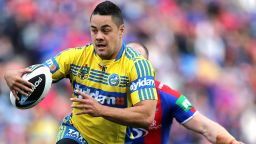 NEWCASTLE, AUSTRALIA - AUGUST 30:  Jarryd Hayne of the Eels evades Beau Scott of the Knights during the round 25 NRL match between the Newcastle Knights and the Parramatta Eels at Hunter Stadium on August 30, 2014 in Newcastle, Australia.  (Photo by Ashley Feder/Getty Images)