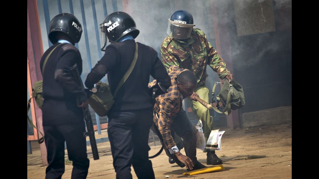 An opposition supporter is beaten with a wooden club by riot police as he tries to flee. Kenyan police tear-gassed and beat opposition supporters <a href="http://www.cnn.com/2016/05/17/africa/kenya-police-violence/" target="_blank">during a protest</a> demanding the disbandment of the electoral authority over alleged bias and corruption. 