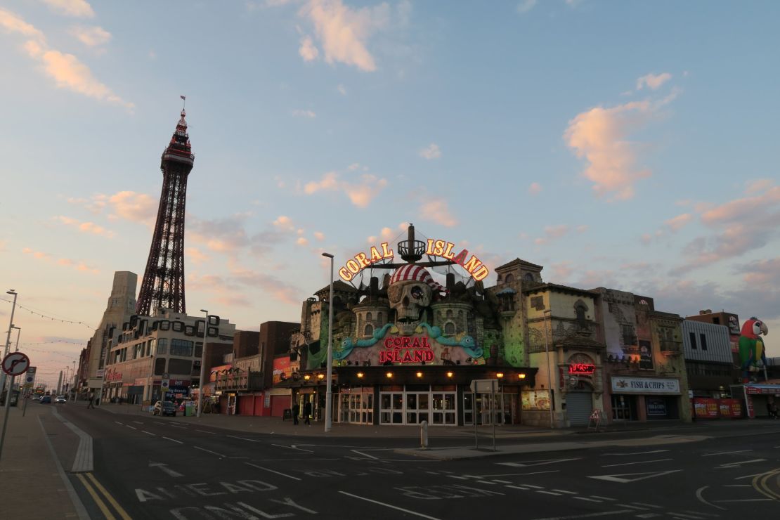 Blackpool Tower and one of the town's amusement arcades at sunset.