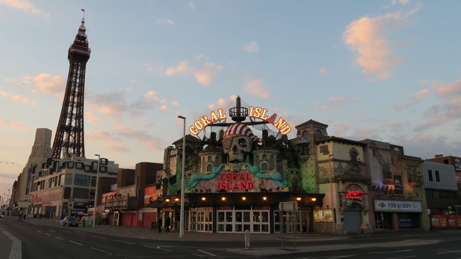 Blackpool Tower and one of the town's amusement arcades at sunset.